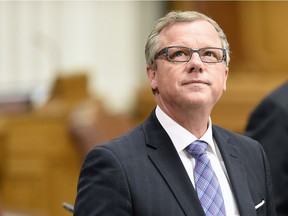 Saskatchewan Premier Brad Wall stands in the Legislative Assembly before question period in Regina.