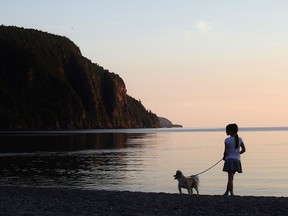 A girl and her dog are seen at Old Woman Bay in Lake Superior Provincial Park.