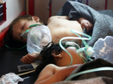 Syrian children receive treatment at a hospital in the town of Maaret al-Noman following a suspected toxic gas attack in Khan Sheikhun, a nearby rebel-held town, April 4, 2017.