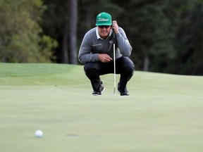 Charley Hoffman lines up his putt on the 18th hole during the first round of the Masters on April 6.