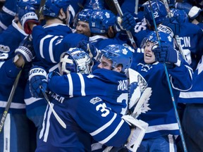 Members of the Toronto Maple Leafs celebrate after Tyler Bozak's game-winning goal in overtime in a 4-3 win over the Washington Capitals in Game 3 of their East Conference quarter-final Monday night in Toronto.