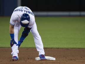 Toronto Blue Jays DH Josh Donaldson holds his calf before leaving the game with an injury on Thursday, April 13, 2017.