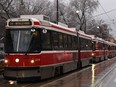 Streetcars are backed up along Queen St. in Toronto, Tuesday, Feb.7, 2017. Heavy rain is forecast for central Ontario and the rest of the south as a weather system moves across the province.