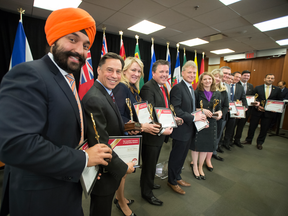 Federal Minister of Innovation Navdeep Bains, left, and assorted other federal and provincial ministers released the completed Canadian Free Trade Agreement in Toronto on Friday, April 7, 2017.