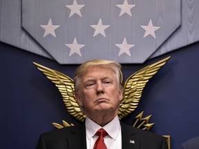 (FILES) US President Donald Trump speaks following the ceremonial swearing-in of James Mattis as secretary of defense on January 27, 2017, at the Pentagon in Washington, DC.
While the new US president has shown a capacity to change, both his tone and his positions, he has been unable to show the world a "new" Trump, with a steady presidential style and a clearly articulated worldview. As the symbolic milestone of his 100th day in power, which falls on April 29, 2017, draws near, a cold, hard reality is setting in for the billionaire businessman who promised Americans he would "win, win, win" for them. At this stage of his presidency, he is the least popular US leader in modern history (even if his core supporters are still totally behind him.) / AFP PHOTO / MANDEL NGAN / TO GO WITH AFP STORY, US-politics-Trump-100days MANDEL NGAN/AFP/Getty Images