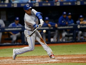 Troy Tulowitzki of the Toronto Blue Jays puts a charge into a pitch for a homerun in the fourth inning of Friday's MLB game in Tampa against the Rays. Despite Tulowitzki's heroics, the Rays were 10-8 winners over the Jays, their third loss in four starts.