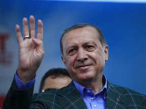 In this Saturday, April 15, 2017 photo, Turkey's President Recep Tayyip Erdogan waves to supporters during the last rally ahead of Sunday's referendum, in Istanbul.