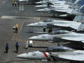 The Pentagon says a Navy carrier strike group is moving toward the western Pacific Ocean to provide a physical presence near the Korean Peninsula
