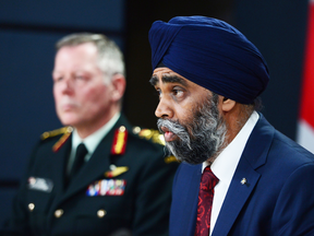 Defence Minister Harjit Sajjan with Gen. Jonathan Vance, Chief of the Defence Staff, in the background.
