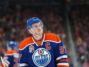 Edmonton Oilers forward Connor McDavid looks skyward after scoring his 100th point of the 2016-17 season on April 9.