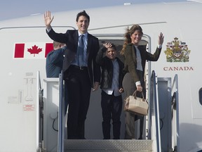Canadian Prime Minister Justin Trudeau and his wife Sophie Gregoire Trudeau and son Xavier board a government plane in Ottawa, Saturday April 8, 2017.