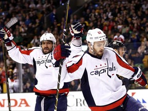 Washington Capitals defenceman Kevin Shattenkirk (right) celebrates a goal against the Boston Bruins with Alex Ovechkin on April 8.