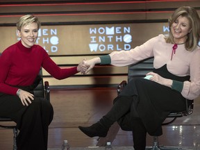 Scarlett Johansson, left, and Arianna Huffington appear together on stage during the Women in the World Summit at Lincoln Center in New York, Thursday, April 6, 2017.