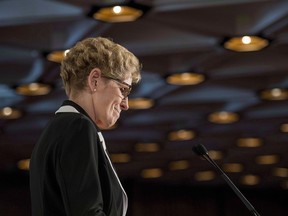 Ontario Premier Kathleen Wynne pauses during a speech in Ottawa on April 30, 2015.