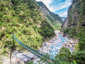 A footbridge crossing near Taiwan's formidable Taroko Gorge, which boasts a two-kilometre-deep valley — and the experience of a lifetime.