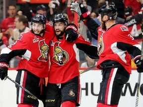 Derik Brassard, left, Clarke MacArthur celebrate and Marc Methot celebrate a Senators goal against the Pittsburgh Penguins in the first period of Game 3 of the Eastern Conference final at the Canadian Tire Centre in Ottawa on Wednesday night.