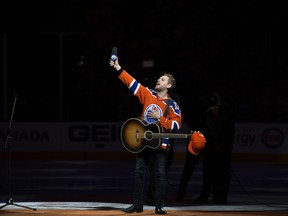 Brett Kissel reacts as fans at Rogers Place sing Star-Spangled Banner, prior to the Edmonton Oilers and Anaheim Ducks, in Edmonton Saturday April 30, 2017.