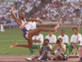 In this 1992 file photo, Mike Powell competes in the long jump at the Barcelona Olympics.