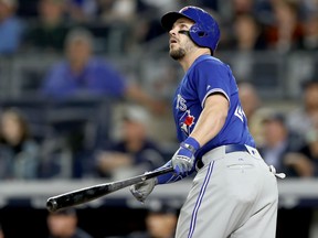 Steve Pearce of the Toronto Blue Jays hits a solo home run in the fifth inning against the Yankees on Tuesday night at Yankee Stadium in New York. Despite Pearce's first two homers as a Blue Jays, the Yankees won 11-5.