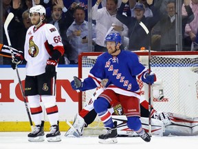Michael Grabner  of the Rangers celebrates his first period goal against Senators goaltender Craig Anderson as Ottawa's Mike Hoffman skates by during Game 3 of their Eastern Conference semifinal series at Madison Square Garden in New York on Tuesday night. The Rangers won 4-1.