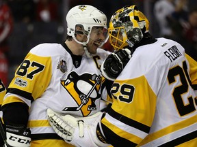 Sidney Crosby and goalie Marc-Andre Fleury of the Penguins celebrate following Pittsburgh's 2-0 win over the Washington Capitals in Game 7 of their Eastern Conference semifinal series at Verizon Center in Washington on Wednesday night.