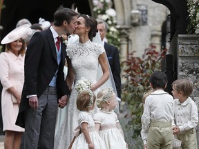 Pippa Middleton and James Matthews kiss after their wedding at St Mark's Church on May 20, 2017 in Englefield, England.