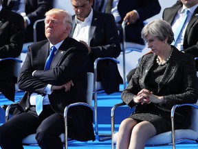 Donald Trump and Theresa May are pictured ahead of a photo opportunity of leaders as they arrive for a NATO summit meeting on May 25, 2017 in Brussels, Belgium