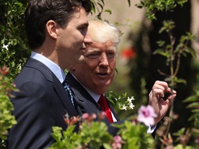 Justin Trudeau and Donald Trump depart after attending the group photo for the G7 Outreach Program