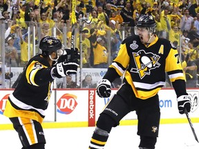 Pittsburgh Penguins forward Evgeni Malkin (right) celebrates a goal against the Nashville Predators on May 29.
