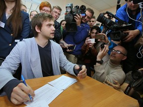 Ruslan Sokolovsky (L), a blogger who played Pokemon Go on his phone in a church, speaks to the press during a hearing at a court in Yekaterinburg on May 11, 2017.