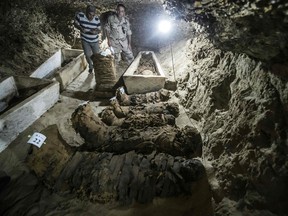 A picture taken on May 13, 2017, shows mummies lying in catacombs following their discovery in the Touna el-Gabal district of the Minya province