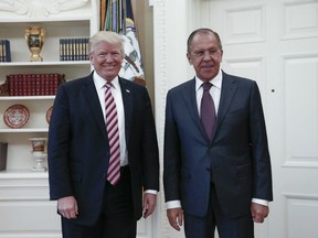 President Donald J. Trump (L) posing with Russian Foreign Minister Sergei Lavrov (R) during their meeting at the White House in Washington, DC on May 10, 2017.