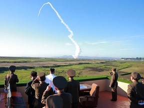 This undated picture released from North Korea's official Korean Central News Agency (KCNA) on May 28, 2017 shows North Korean leader Kim Jong-Un watching the test of a new anti-aircraft guided weapon system organized by the Academy of National Defence Science at an undisclosed location.