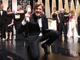 Swedish director Ruben Ostlund poses on stage with his trophy after he won the Palme d'Or for his film 'The Square' on May 28, 2017 during the closing ceremony of the 70th edition of the Cannes Film Festival in Cannes, southern France.