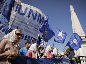 Mothers of Plaza de Mayo human rights group do their traditional Thursday march around the obelisk at Plaza de Mayo in Buenos Aires, Argentina in 2016