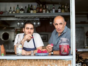 Israeli chef Tomer Amedi, left, who grew up in a "fairly traditional" Jewish home in Jerusalem, says his Kurdish father, right, and Moroccan mother are both amazing cooks.