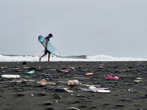 Bali beach littered with marine plastic pollution.