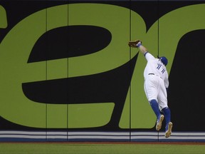 Toronto Blue Jays centre fielder Kevin Pillar makes a diving catch on Cleveland second baseman Jose Ramirez on May 8.