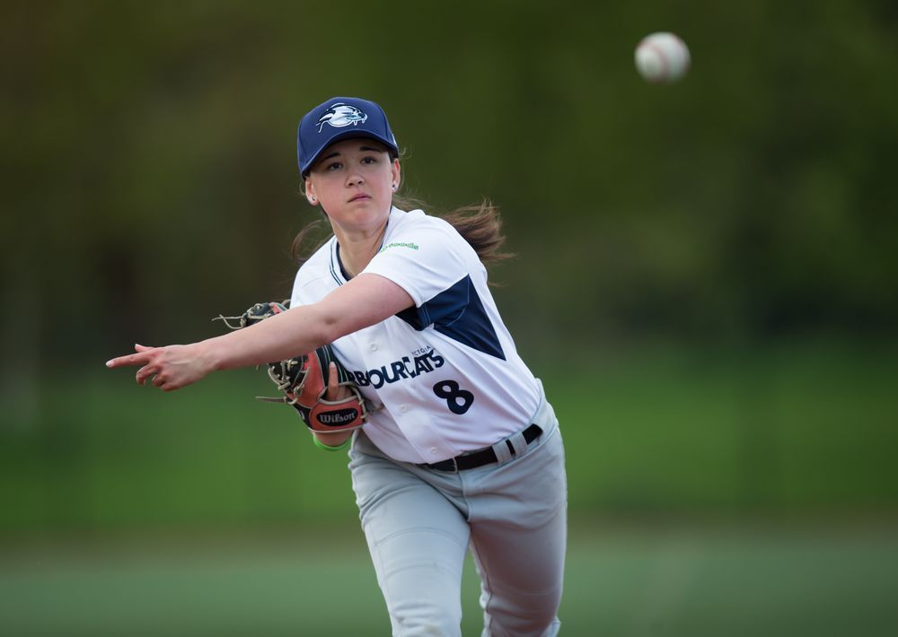 Claire Eccles, 19, pitches while posing for a photograph at the University  of British Columbia in Vancouver, B.C., on Friday May 12, 2017. The  Victoria HarbourCats announced Tuesday that Eccles will join