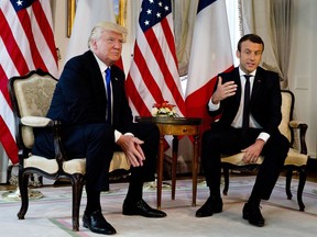 French President Emmanuel Macron gestures as he meets with U.S. President Donald Trump at the U.S. ambassador's residence in Brussels, Thursday, May 25, 2017. World leaders, including French President Emmanuel Macron and US President Donald Trump are in Belgium to attend a NATO summit. (AP Photo/Peter Dejong, Pool)