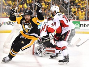 Pittsburgh Penguins forward Chris Kunitz (left) celebrates a goal against the Ottawa Senators on May 25.