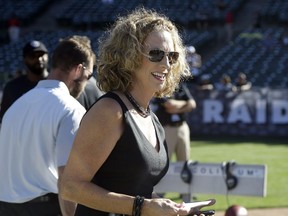 In this Aug. 14, 2015, file photo, announcer Beth Mowins prepares on the field before calling an NFL preseason football game between the Rams and Raiders in Oakland, Calif. It has been 30 years since a woman did play-by-play on an NFL telecast.