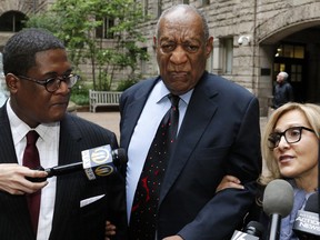 Bill Cosby pauses in the courtyard as one of his attorneys Angela Agrusa, right, makes a statement to the media, as they arrive for the third day of jury selection in his sexual assault case at the Allegheny County Courthouse, Wednesday, May 24, 2017, in Pittsburgh. The case is set for trial June 5 in suburban Philadelphia.