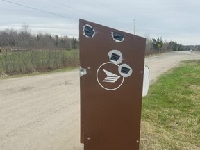 The mailbox on Birdton Road, which black tape covering the bullet holes — to keep rainwater off the mail.