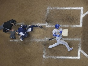 Toronto Blue Jays infielder Ryan Goins hits a grand slam in the sixth inning against the Milwaukee Brewers on May 24.