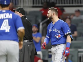 In this photo taken May, 17, Toronto Blue Jays CF Kevin Pillar (11) looks on as both benches empty onto the field after he exchanged words with Atlanta Braves relief pitcher Jason Motte.