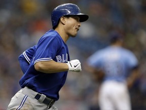 Toronto Blue Jays infielder Darwin Barney runs around the bases after his home run against the Tampa Bay Rays on May 7.
