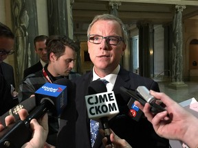 Saskatchewan Premier Brad Wall talks to reporters at the legislature in Regina, Monday, May 1, 2017. The Saskatchewan government says it will invoke the notwithstanding clause of the Charter of Rights and Freedoms so it can keep Catholic school funding for non-Catholic students.
