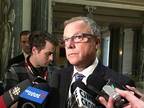 Saskatchewan Premier Brad Wall talks to reporters at the legislature in Regina, Monday, May 1, 2017. The Saskatchewan government says it will invoke the notwithstanding clause of the Charter of Rights and Freedoms so it can keep Catholic school funding for non-Catholic students.