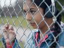 The star of the CFL’s new TV spot is a 13-year-old girl who wanders by a pick-up game of flag football.